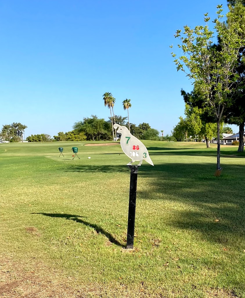 Panoramic view of a lush green golf course at Quail Run Golf Course. Smooth