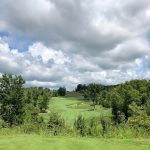 Panoramic view of a lush green golf course at Quarry Golf Course Maintenance Facility. Smooth