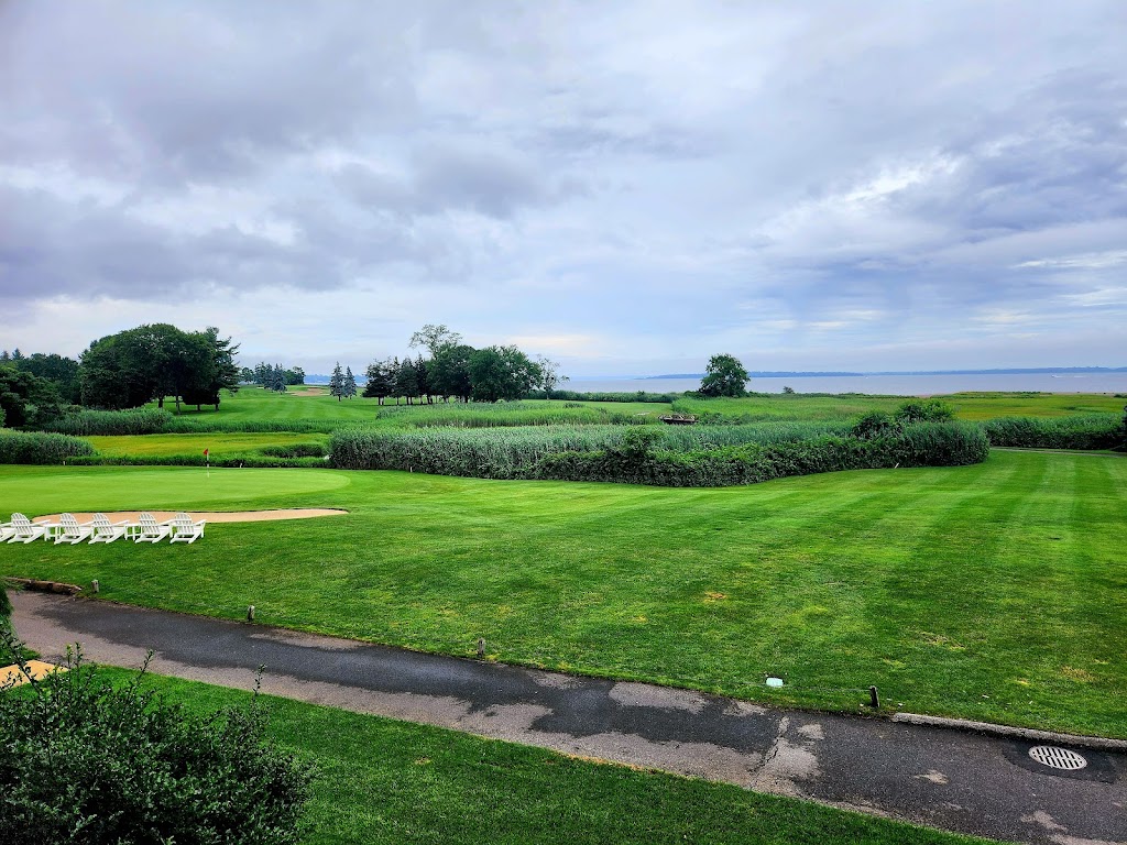 Panoramic view of a lush green golf course at Quidnessett Country Club. Smooth