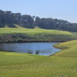 Panoramic view of a lush green golf course at RTJ Golf Trail at Ross Bridge. Smooth