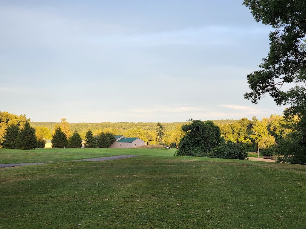 Panoramic view of a lush green golf course at Raceway Golf Club. Smooth