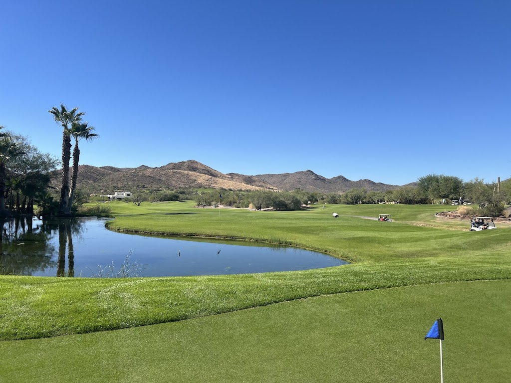 Panoramic view of a lush green golf course at Rancho Manana Golf Club. Smooth