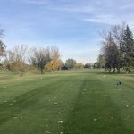 Panoramic view of a lush green golf course at Ray Richards Golf Course. Smooth