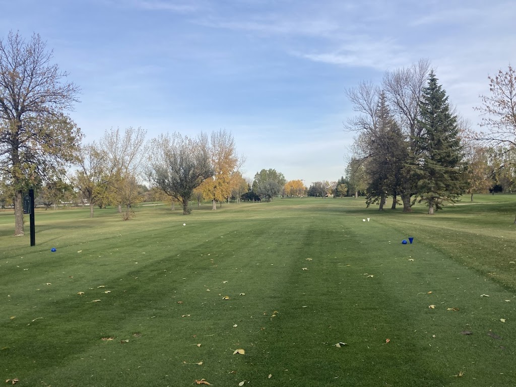 Panoramic view of a lush green golf course at Ray Richards Golf Course. Smooth