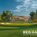 Panoramic view of a lush green golf course at Red Hawk Golf and Resort. Smooth