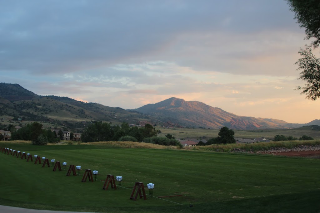 Panoramic view of a lush green golf course at Red Rocks Country Club. Smooth