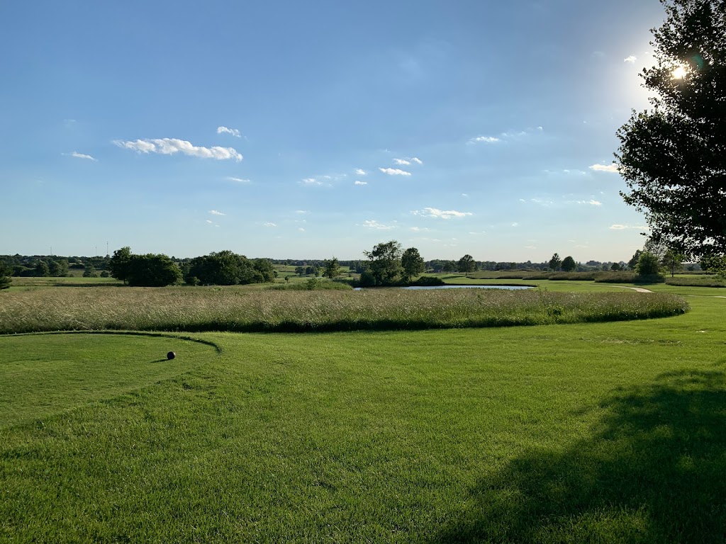 Panoramic view of a lush green golf course at Redfield Golf Course. Smooth