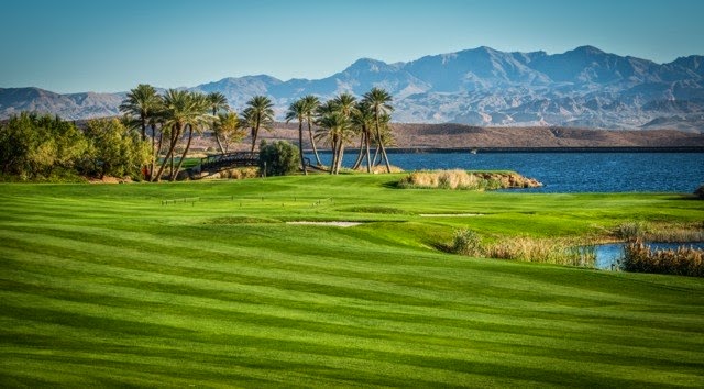 Panoramic view of a lush green golf course at Reflection Bay Golf Club. Smooth