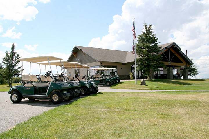 Panoramic view of a lush green golf course at Rendezvous Meadows Golf Course. Smooth