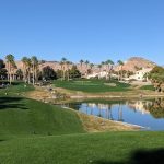 Panoramic view of a lush green golf course at Rhodes Ranch Golf Club. Smooth