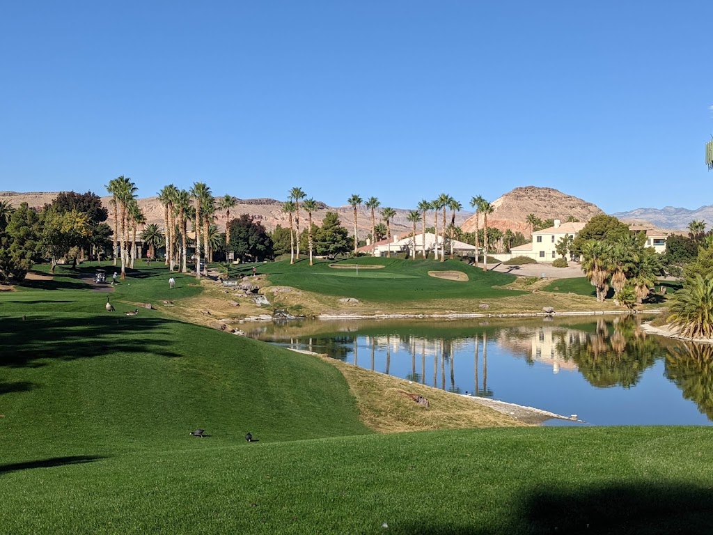 Panoramic view of a lush green golf course at Rhodes Ranch Golf Club. Smooth