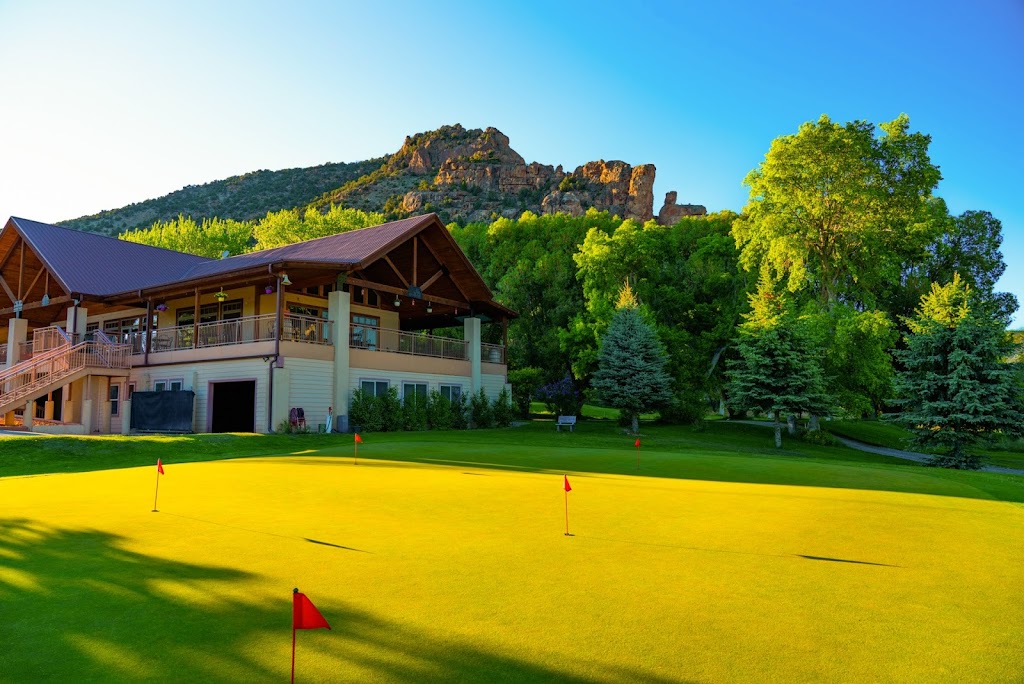 Panoramic view of a lush green golf course at Rifle Creek Golf Course. Smooth