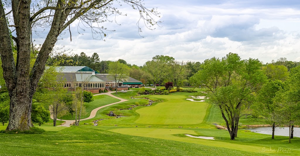 Panoramic view of a lush green golf course at River Bend Golf & Country Club. Smooth