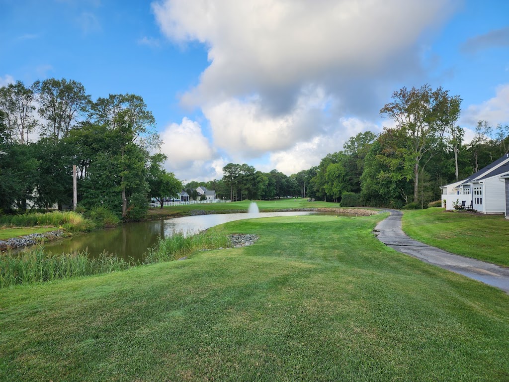 Panoramic view of a lush green golf course at River Run Golf Club & Community. Smooth