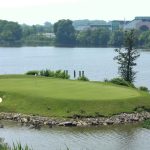 green grass with the flag in the hole.