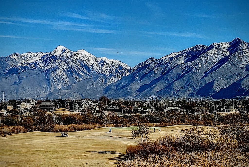 Panoramic view of a lush green golf course at Riverbend Golf Course. Smooth