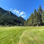 Panoramic view of a lush green golf course at Rivers Bend Golf Course. Smooth