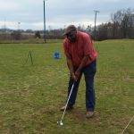 green grass with the flag in the hole.