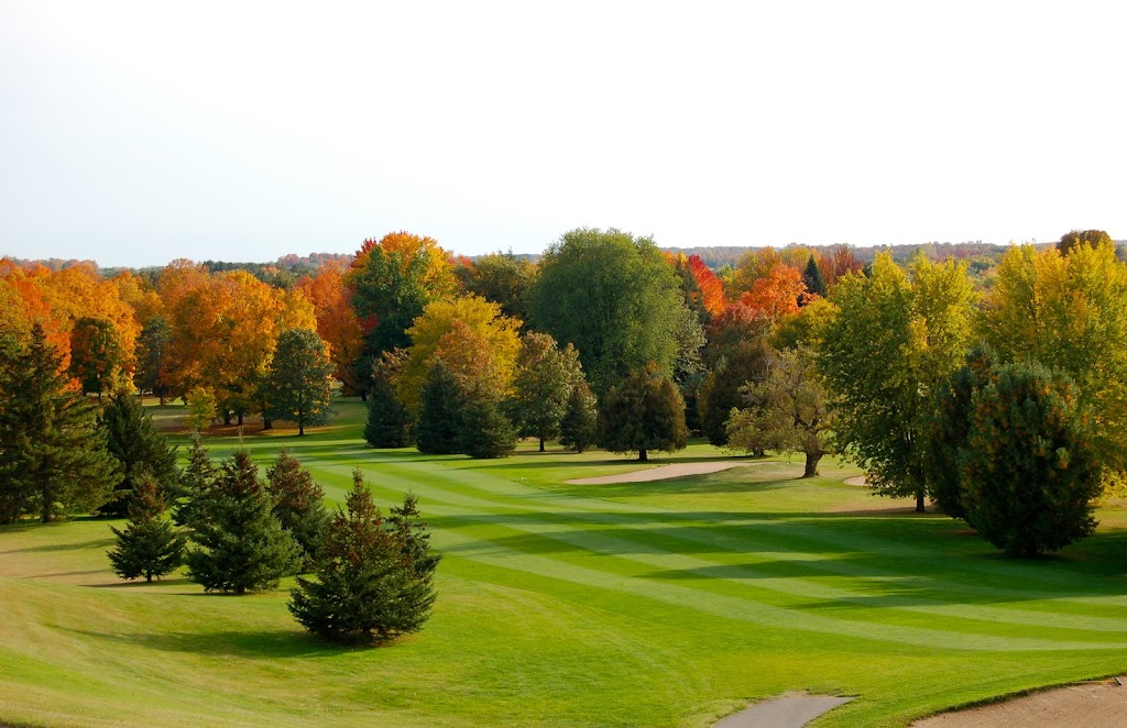 Panoramic view of a lush green golf course at Riverside Golf Course. Smooth