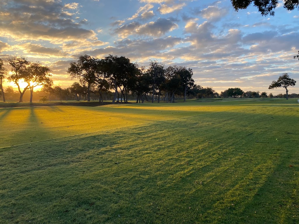 Panoramic view of a lush green golf course at Riverside Golf Course. Smooth