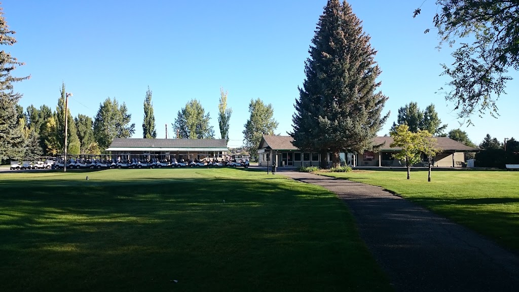 Panoramic view of a lush green golf course at Riverton Country Club. Smooth