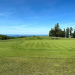 Panoramic view of a lush green golf course at Roaring Gap Club. Smooth