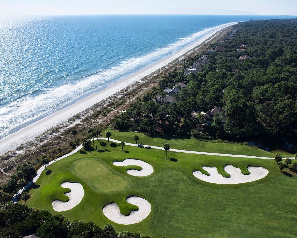 Panoramic view of a lush green golf course at Robert Trent Jones Oceanfront Golf Course. Smooth