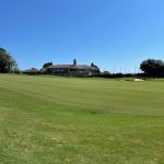 Panoramic view of a lush green golf course at Rock Barn Country Club and Spa. Smooth