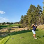 Panoramic view of a lush green golf course at Rock Creek Cattle Company. Smooth