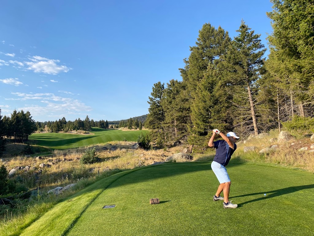 Panoramic view of a lush green golf course at Rock Creek Cattle Company. Smooth