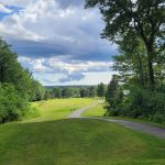 Panoramic view of a lush green golf course at Rockland Golf Club. Smooth