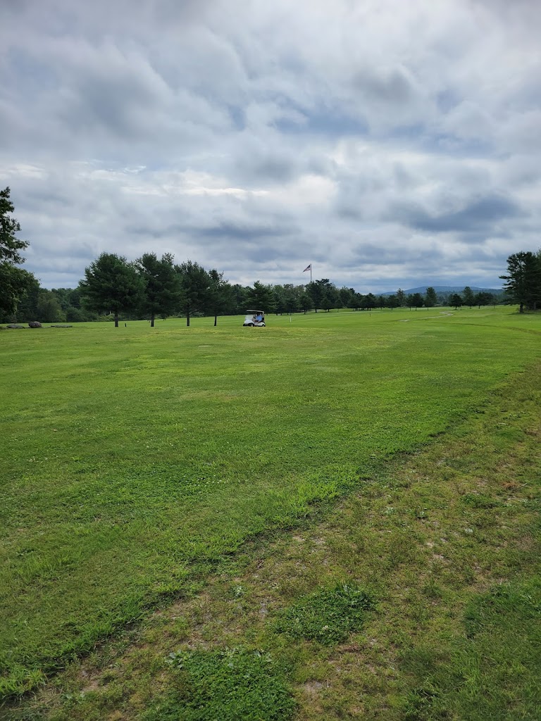 Panoramic view of a lush green golf course at Rocky Knoll Country Club. Smooth