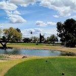 Panoramic view of a lush green golf course at Rolling Hills Golf Course. Smooth