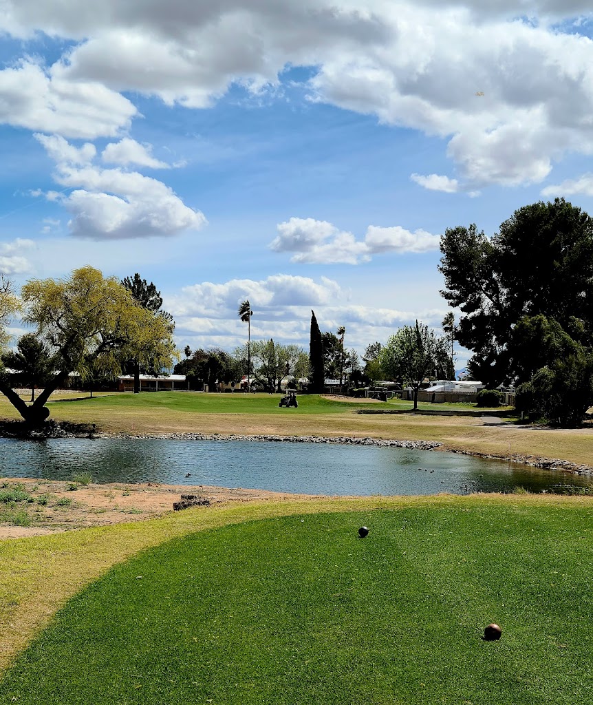 Panoramic view of a lush green golf course at Rolling Hills Golf Course. Smooth