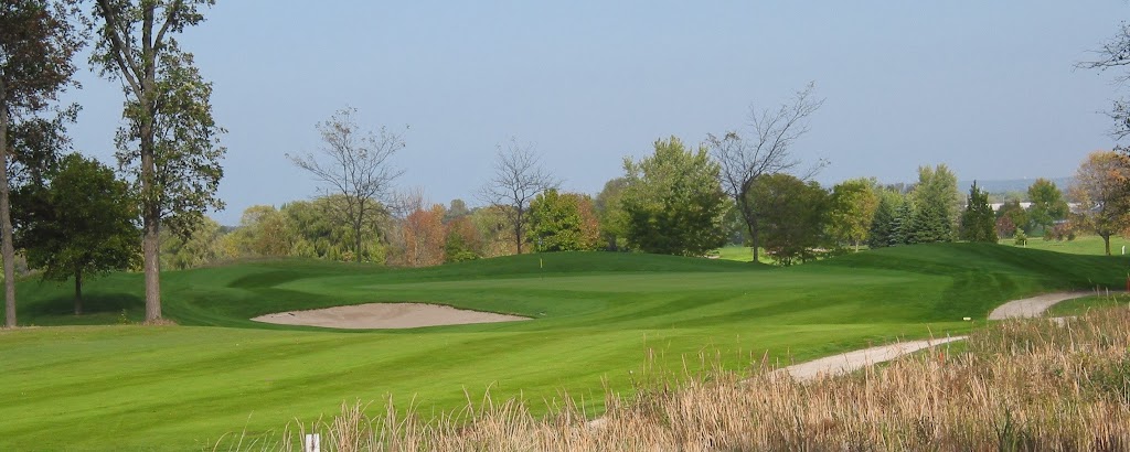 Panoramic view of a lush green golf course at Rolling Meadows Golf Course. Smooth