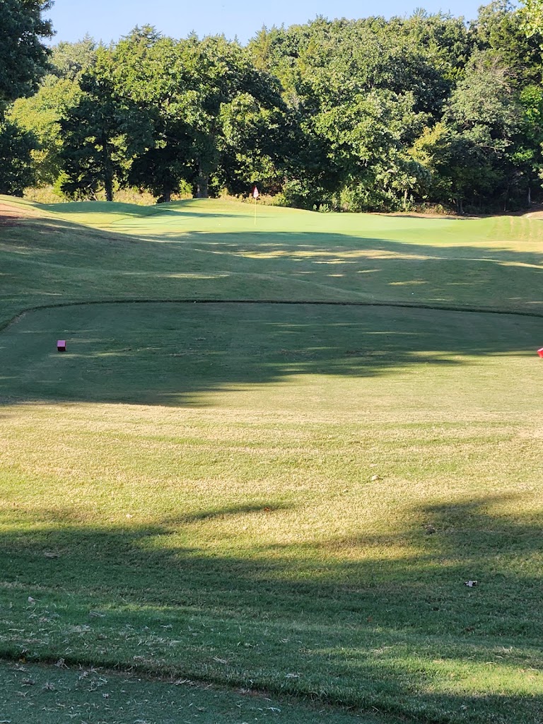 Panoramic view of a lush green golf course at Roman Nose State Park Golf Course. Smooth