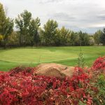 Panoramic view of a lush green golf course at Roosevelt Golf Course. Smooth