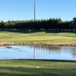 Panoramic view of a lush green golf course at Rose Hill Golf Club. Smooth