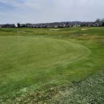 Panoramic view of a lush green golf course at Roses Run Country Club. Smooth