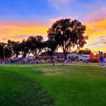 Panoramic view of a lush green golf course at Roswell Country Club. Smooth