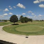 green grass with the flag in the hole.