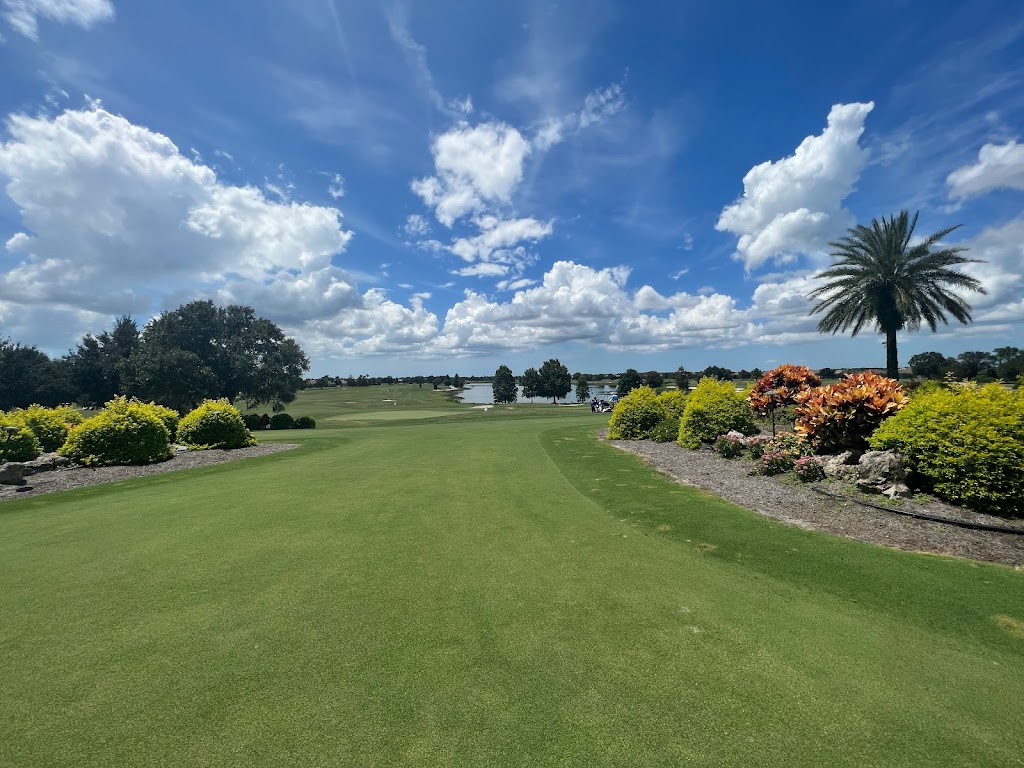 Panoramic view of a lush green golf course at Royal Lakes Golf Course. Smooth