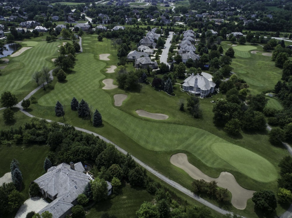 Panoramic view of a lush green golf course at Ruffled Feathers Golf Club. Smooth