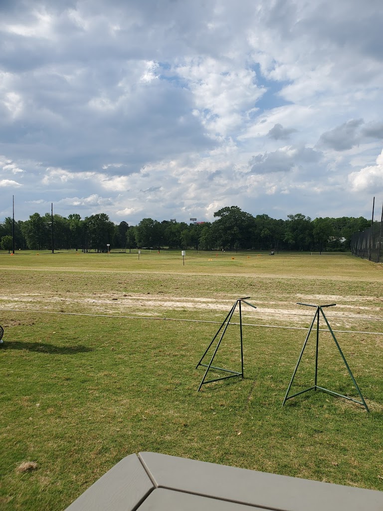 Panoramic view of a lush green golf course at Rum Creek Golf. Smooth