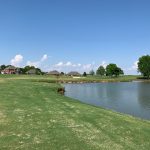 Panoramic view of a lush green golf course at Sage Meadows Country Club. Smooth