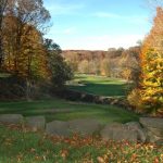 Panoramic view of a lush green golf course at Salt Creek Golf Retreat. Smooth