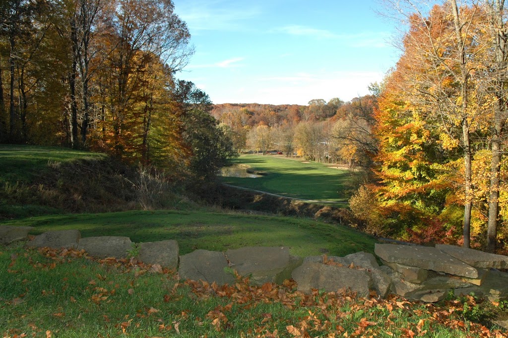 Panoramic view of a lush green golf course at Salt Creek Golf Retreat. Smooth