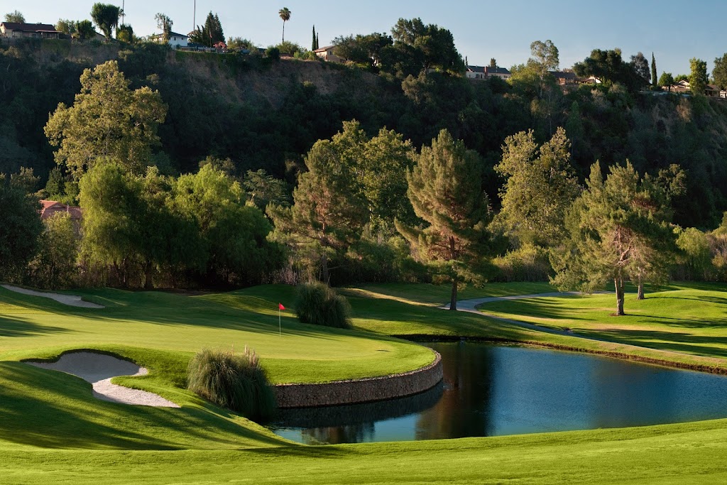 Panoramic view of a lush green golf course at San Dimas Canyon Golf Course. Smooth