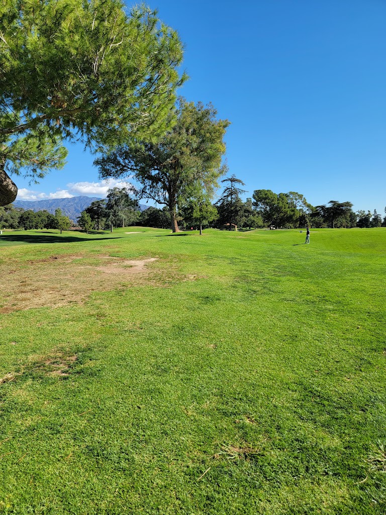 Panoramic view of a lush green golf course at Santa Anita Golf Course. Smooth