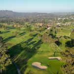 Panoramic view of a lush green golf course at Santa Barbara Golf Club. Smooth